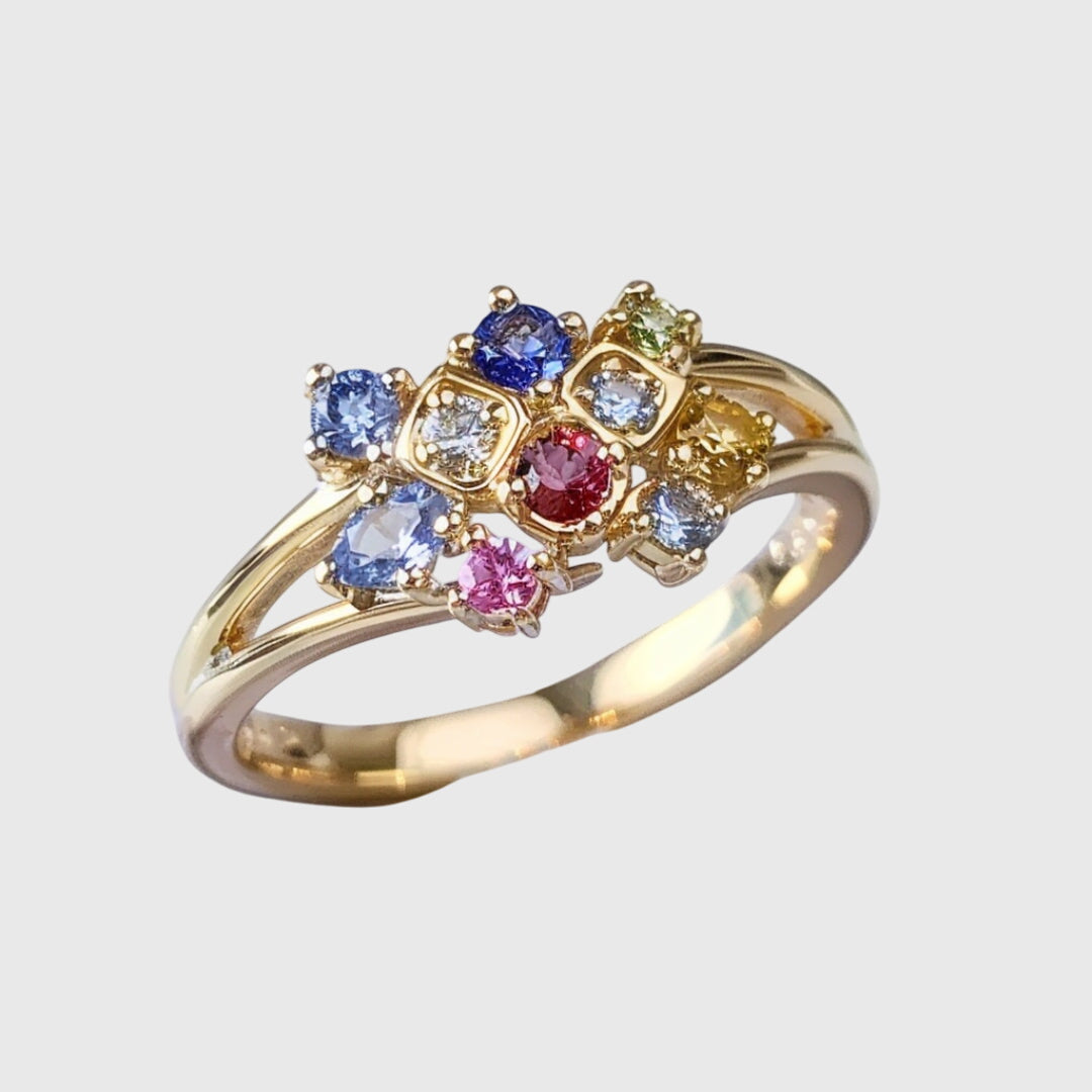 Gold ring with coloured crystal